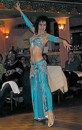 Photo of Bonita dancing in blue costume.